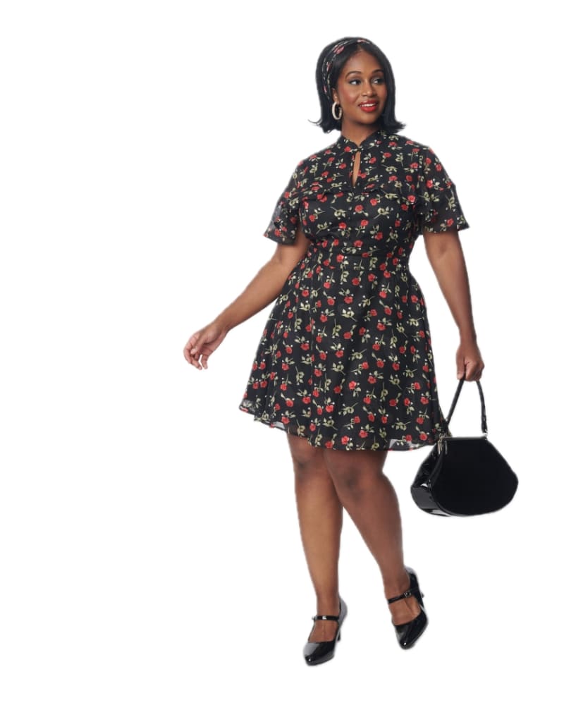 Front of a model wearing a size L Unique Vintage Black & Red Rose Capulet Fit & Flare Dress in black & red roses by Unique Vintage. | dia_product_style_image_id:332637